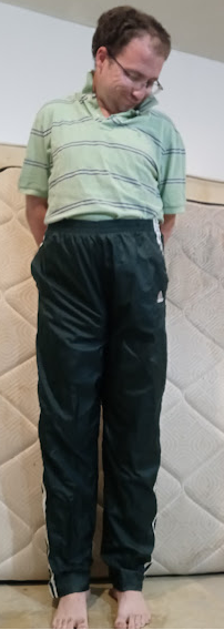 Me in my Medium Forest Green Adidas Nylon Pants (with my hands behind my back) 2.png