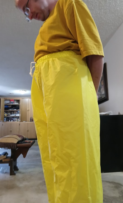 Me in my yellow shirt & my NEW yellow nylon pants w/my hands behind my back (side 1)