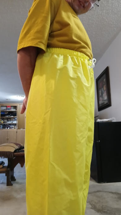 Me in my yellow shirt & my NEW yellow nylon pants w/my hands behind my back (side 2)
