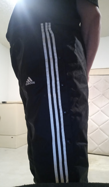 Me wearing my Small Black Adidas Nylon Pants with my hands behind my back 3