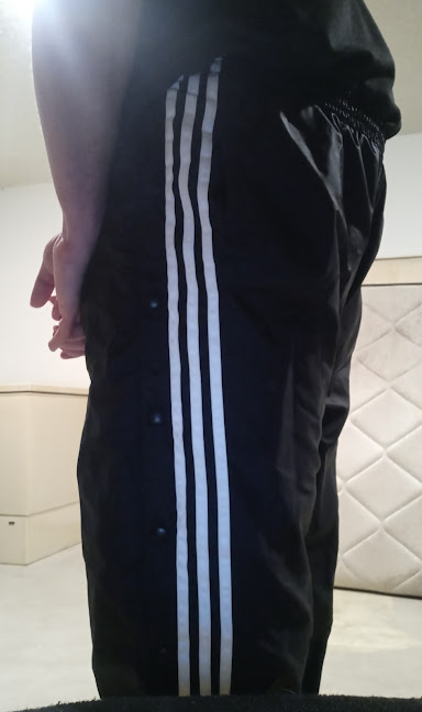 Me wearing my Small Black Adidas Nylon Pants with my hands behind my back 4