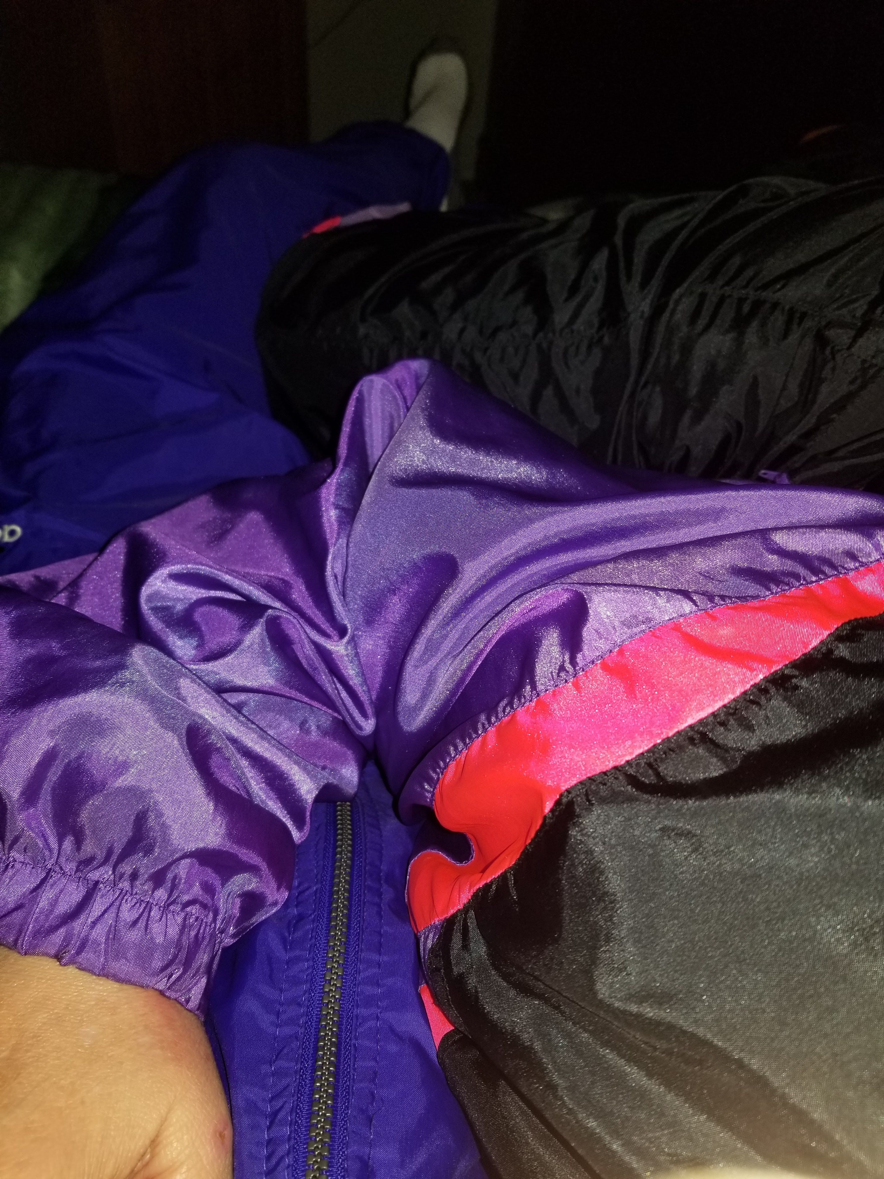 Our swishy suits in bed for some fun nylon action