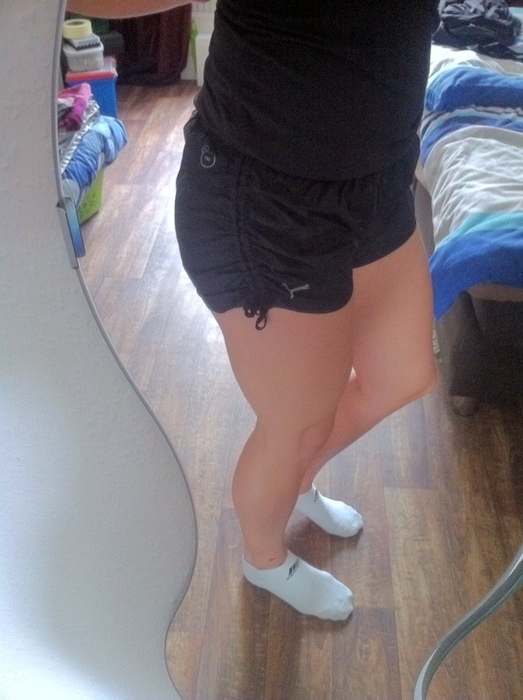 Sporty girl in shiny Puma shorts