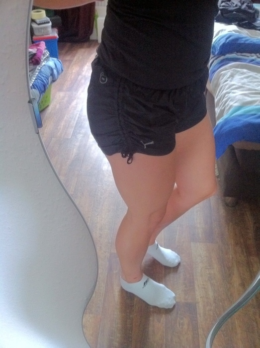 Sporty girl in shiny Puma shorts