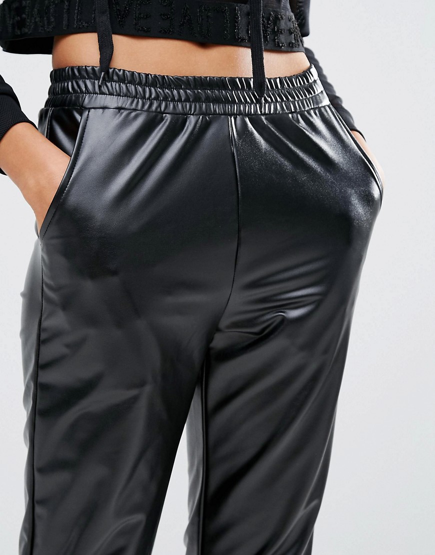 Tall girl in shiny pants front close up