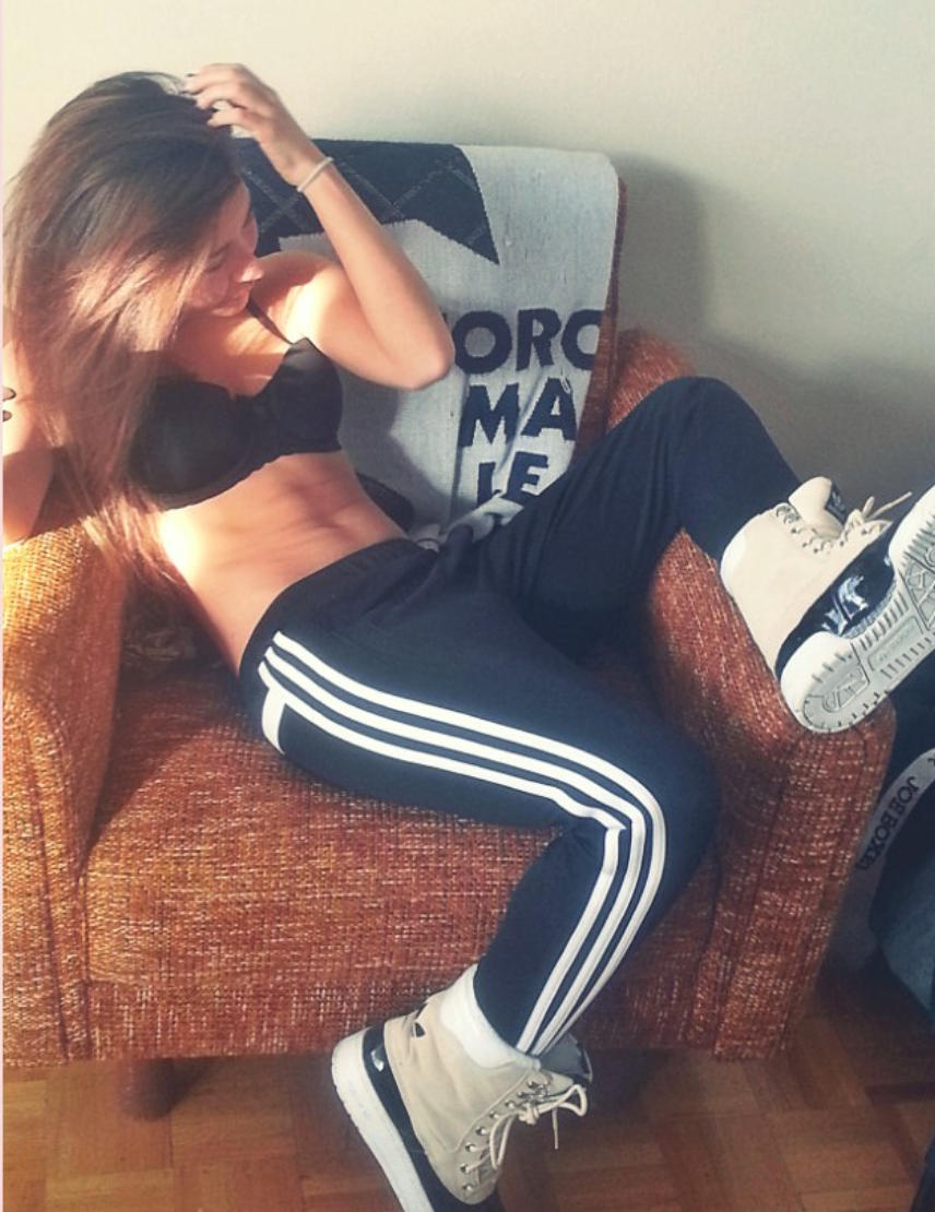 Topless girl in adidas pants