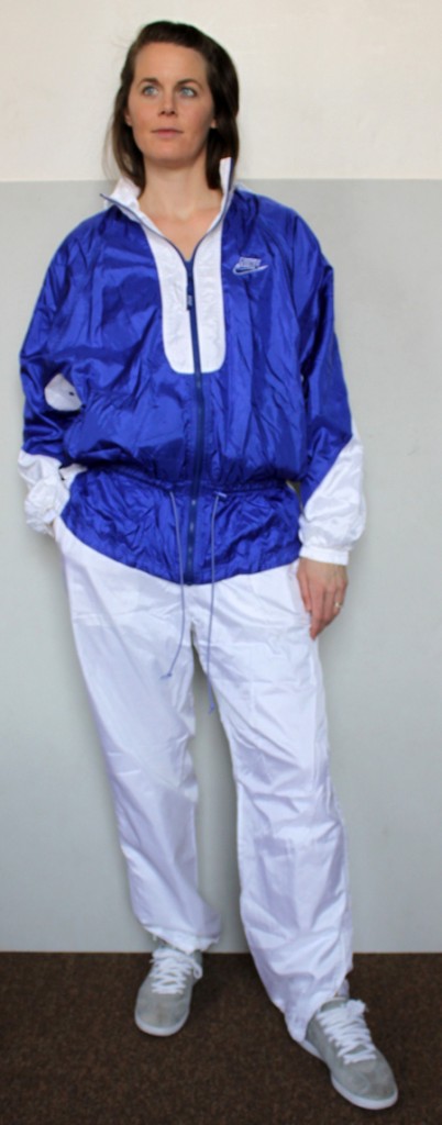 Woman in blue and white Nike shellsuit, full front shot