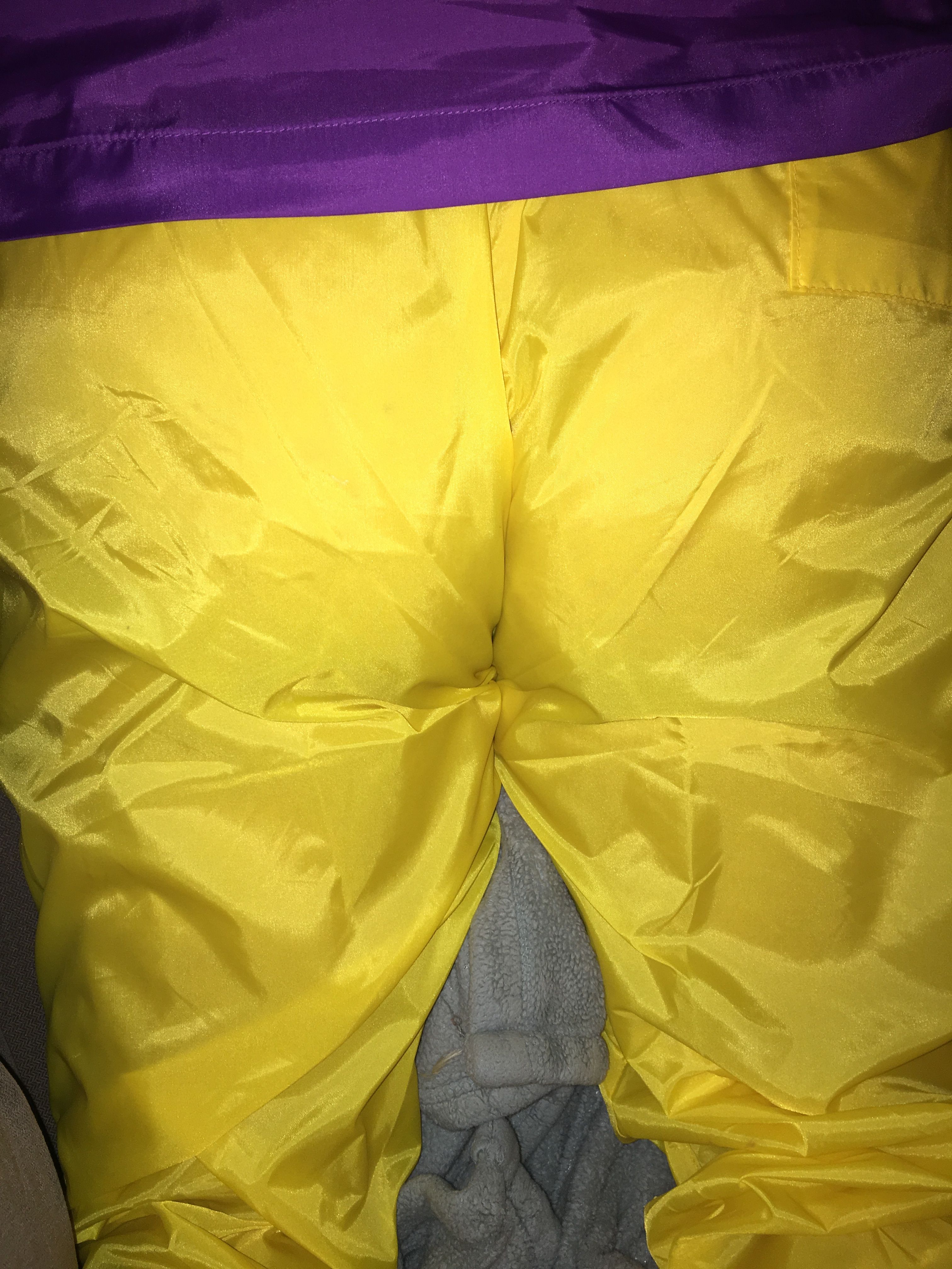 yellow wind pants and purple Columbia packable jacket